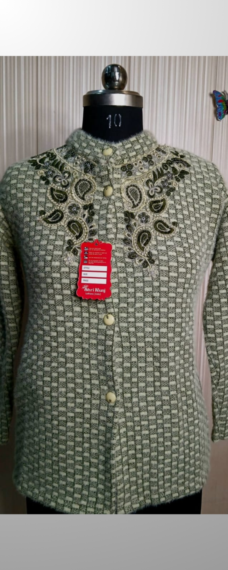 Green Woolen cardigans with embroidery work.