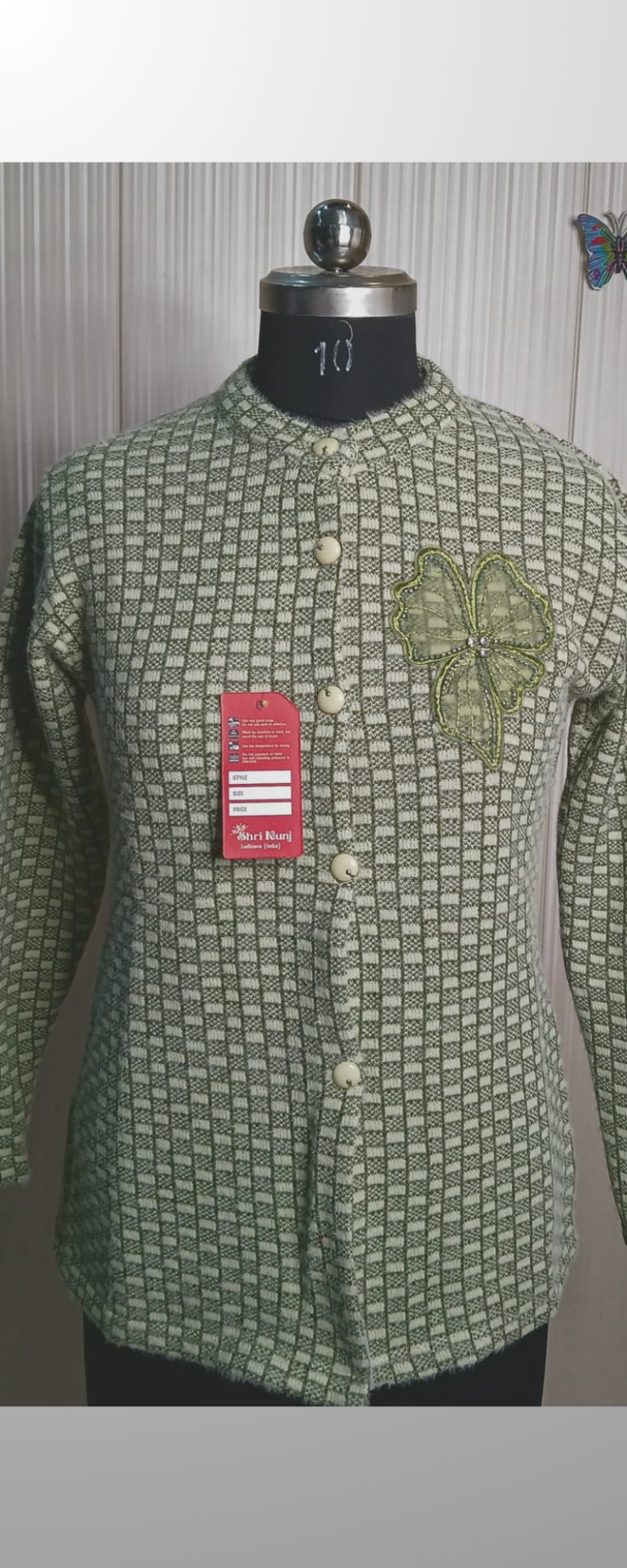 Green Woolen cardigans with embroidery work.